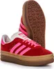 A pair of Adidas Gazelle Bold women's sneakers, one shoe is shown from the side and the other from the sole. Produktbild-Vorschau