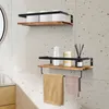 Two wooden shelves mounted on a speckled wall, with bathroom items and towels displayed. Náhled obrázku produktu