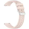 A close-up studio shot of a pink silicone watch band.