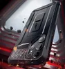 A rugged black phone case with a kickstand is shown in a dynamic, action-oriented scene with sparks and debris. Produktbild-Vorschau