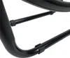 A close-up view of the black metal frame of a firewood rack, showing the curved shape and connecting rods. Podgląd zdjęcia produktu