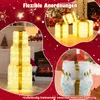 A collage of illuminated Christmas gift boxes in various arrangements, with festive decorations and a fireplace in the background. Podgląd zdjęcia produktu