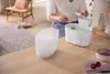 A person is using a baby bottle sterilizer in a kitchen. Produktbild-Vorschau