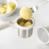 A potato masher is shown with cooked potatoes being prepared. Anteprima dell’immagine prodotto