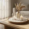 Weiße Deko-Steine auf einem Holztablett mit Kerzen zur Tischdekoration im Wohnzimmer Produktbild-Vorschau