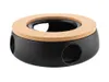 A black ceramic warmer with a cork top and circular openings on the sides, isolated on a white background. Anteprima dell’immagine prodotto