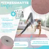 A woman is performing a yoga pose on a pink yoga mat in a bright, modern room. Produktbild-Vorschau