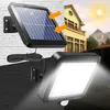 A solar-powered outdoor light with a motion sensor is shown, with a separate solar panel connected by a wire. The background depicts a house and a sunny sky, suggesting outdoor use. Produktbild-Vorschau