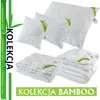 A collection of white bedding products, including pillows and a comforter, displayed with bamboo stalks and text. Produktbild-Vorschau
