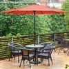 An outdoor patio scene with a table and chairs under an orange umbrella. Produktbild-Vorschau