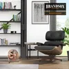 A modern living room with a bookshelf, a chair, and a fan. Produktbild-Vorschau