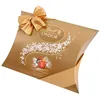 A gold pillow box of Lindt Lindor chocolates, tied with a gold ribbon and bow. Produktbild-Vorschau