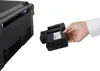 A hand is shown inserting a toner cartridge into a printer. Produktbild-Vorschau