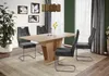 A dining room scene with a table and chairs. Produktbild-Vorschau