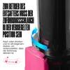 Close-up of a black juicer with a pink locking mechanism and instructional text. Náhled obrázku produktu