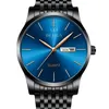 A close-up studio shot of a men's wristwatch with a blue dial and black metal band. Voir les images du produit