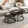 A modern living room scene with a sectional sofa and two round coffee tables. Náhľad obrázku produktu