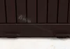 A close-up view of the bottom of a brown storage box, showing its feet and a watermark. Podgląd zdjęcia produktu