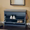 A blue shoe cabinet with a gray seat cushion is shown in a hallway or entryway setting. Náhľad obrázku produktu