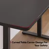 A close-up view of the corner of a black desk with a red accent line, showing its curved design. Náhled obrázku produktu