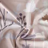 A close-up view of a fabric with a floral pattern. Produktbild-Vorschau