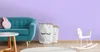 A child's room with a sofa, a rocking horse, and storage baskets. Produktbild-Vorschau