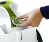 A hand is adjusting a dial on a white and green appliance. Anteprima dell’immagine prodotto