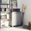 A storage cabinet with various items stored on shelves and around it. Voir les images du produit