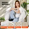 A woman is sitting in a white hanging chair, with plants in the background. There are also close-up images of the chair's materials. Podgląd zdjęcia produktu