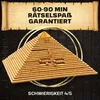 A wooden pyramid puzzle box is displayed prominently in the center, surrounded by golden rings. The background features dark, textured patterns resembling hieroglyphs. Text overlays provide information about the product's playtime and difficulty. Podgląd zdjęcia produktu