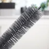 Close-up of a gray cleaning brush with bristles. Podgląd zdjęcia produktu