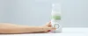 A hand is shown operating a portable bottle warmer with a baby bottle on top. Náhľad obrázku produktu