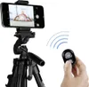 A smartphone is mounted on a tripod, and a remote control is held in a hand. Náhľad obrázku produktu