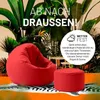 A red beanbag chair and ottoman are placed on a rug with a zebra pattern, surrounded by lush green plants. The scene is set outdoors, suggesting a relaxed, tropical atmosphere. Produktbild-Vorschau