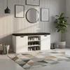 A shoe cabinet with a bench seat in a hallway, with a rug and a plant. Náhľad obrázku produktu