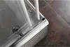 Close-up view of a shower enclosure corner, showing the glass, frame, and tiling. Náhľad obrázku produktu