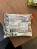 The back of a Yum Yum Instant Noodle package is shown on a wooden table. Anteprima dell’immagine prodotto
