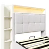 A close-up view of a bed frame with a padded headboard and built-in shelving. Produktbild-Vorschau