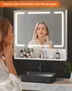 A woman is looking at herself in a lighted mirror above a sink in a modern bathroom. Voir les images du produit