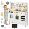 A child playing with a toy kitchen set. Produktbild-Vorschau