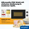 A marketing image showcasing a white microwave with a black front, accompanied by awards, product details, and popcorn. Produktbild-Vorschau