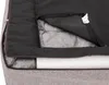 A close-up view of the interior of a dog bed, showing the quilted padding and a white foam insert. Produktbild-Vorschau