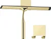 A gold shower squeegee and its wall mount are displayed against a white background. Náhľad obrázku produktu