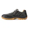 A side view of a black safety shoe with a tan sole. Produktbild-Vorschau