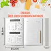 An open cookbook with blank pages for recipes, alongside ingredients like tomatoes and spaghetti. Produktbild-Vorschau