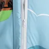 A close-up of a zipper on a blue duvet cover with a cartoon pattern. Podgląd zdjęcia produktu