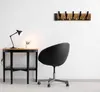 A modern home office setup with a desk, chair, and wall-mounted coat rack. Produktbild-Vorschau