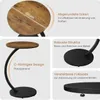 Collage of images showing details of a round side table with a vintage wood-look top and black metal base. Produktbild-Vorschau