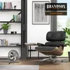 A modern living room with a bookshelf, a chair, and a fan. Podgląd zdjęcia produktu