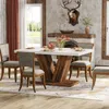 A dining room scene with a table and chairs set up for a meal. Anteprima dell’immagine prodotto